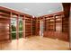 Spacious library with built-in wooden bookshelves and hardwood floors at 2942 Seabrook Island Rd, Seabrook Island, SC 29455