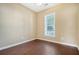 Bright bedroom with wood floors and large window at 307 Pimpernel St, Summerville, SC 29483