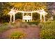 White Gables community entrance with illuminated pergola and landscaping at 307 Pimpernel St, Summerville, SC 29483