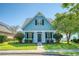 Charming light blue house with a front porch, landscaping, and walkway at 307 Pimpernel St, Summerville, SC 29483