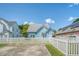Cute light blue house with white picket fence and spacious concrete driveway at 307 Pimpernel St, Summerville, SC 29483