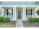 Inviting front porch with white columns and black shutters at 307 Pimpernel St, Summerville, SC 29483