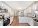 Open concept kitchen with island and stainless steel appliances at 307 Pimpernel St, Summerville, SC 29483