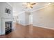 Spacious living room with hardwood floors, fireplace, and ceiling fan at 307 Pimpernel St, Summerville, SC 29483