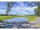 Serene pond with clubhouse reflection at 307 Pimpernel St, Summerville, SC 29483