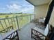 Private balcony with patio furniture, overlooking the marsh at 3701 Dock Site Rd # 205, Edisto Beach, SC 29438