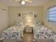 Bedroom with twin beds and coastal bedding at 3701 Dock Site Rd # 205, Edisto Beach, SC 29438