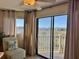 Bedroom with sliding glass door to balcony overlooking marsh at 3701 Dock Site Rd # 205, Edisto Beach, SC 29438