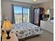 Main bedroom with king-size bed, balcony access, and coastal decor at 3701 Dock Site Rd # 205, Edisto Beach, SC 29438