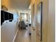 Bright condo entryway with hardwood floors and glimpse of living area at 3701 Dock Site Rd # 205, Edisto Beach, SC 29438