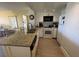 Bright kitchen with granite counters and white cabinetry at 3701 Dock Site Rd # 205, Edisto Beach, SC 29438
