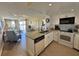Open concept kitchen with granite island and stainless steel appliances at 3701 Dock Site Rd # 205, Edisto Beach, SC 29438