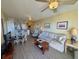 Open living area with adjacent kitchen, comfortable seating, and hardwood floors at 3701 Dock Site Rd # 205, Edisto Beach, SC 29438