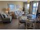 Comfortable living room featuring a beige sofa and glass-top table at 3701 Dock Site Rd # 205, Edisto Beach, SC 29438