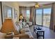 Bright living room with water views, comfy seating, and a convenient coffee table at 3701 Dock Site Rd # 205, Edisto Beach, SC 29438