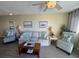 Spacious living room featuring two armchairs, a sofa, and a coffee table at 3701 Dock Site Rd # 205, Edisto Beach, SC 29438