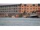 Boats docked at the waterfront with building in background at 3701 Dock Site Rd # 205, Edisto Beach, SC 29438