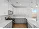 Modern kitchen with gray and white cabinets and stainless steel appliances at 428 Grove End Rd, Moncks Corner, SC 29461