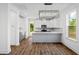 Modern kitchen with gray and white cabinets and island at 428 Grove End Rd, Moncks Corner, SC 29461