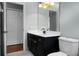 Bathroom features dark vanity and a large mirror at 5382 Westchester Pl, North Charleston, SC 29418