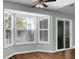 Bright breakfast nook with bay window and access to the sunroom at 5382 Westchester Pl, North Charleston, SC 29418