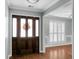Bright entryway with hardwood floors and a view to the living room at 5382 Westchester Pl, North Charleston, SC 29418