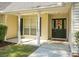 Inviting front porch with white columns and a black front door at 5382 Westchester Pl, North Charleston, SC 29418