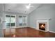 Spacious living room with hardwood floors, fireplace, and access to a sunroom at 5382 Westchester Pl, North Charleston, SC 29418