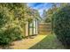 Small garden shed nestled in a private corner of the backyard at 5382 Westchester Pl, North Charleston, SC 29418