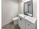 Modern bathroom with white vanity, black fixtures, and a walk-in shower at 105 Gambels Ln, Summerville, SC 29485