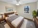 Cozy bedroom with wood bed frame and ceiling fan at 105 Gambels Ln, Summerville, SC 29485