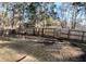 Large fenced backyard with wooden picnic table at 111 Downing Ct, Goose Creek, SC 29445