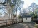 Fenced backyard with storage shed and large trees at 111 Downing Ct, Goose Creek, SC 29445