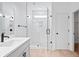 Bathroom with white tile, frameless shower, and modern vanity at 1137 Happyland Blvd, Mount Pleasant, SC 29466