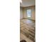 Well-lit bedroom with wood-look floors and window at 126 Addison Rd, Harleyville, SC 29448
