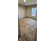 Spacious bedroom with wood-look flooring and window at 126 Addison Rd, Harleyville, SC 29448