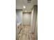 Light and bright hallway with wood-look flooring at 126 Addison Rd, Harleyville, SC 29448