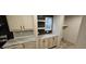 Kitchen boasts light wood cabinets, granite countertops, and a convenient pass-through window at 126 Addison Rd, Harleyville, SC 29448