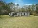 Ranch home with large yard and mature trees at 139 Yellowstone Ln, Ridgeville, SC 29472