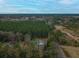 Aerial view showing house and surrounding wooded area at 1420 Old Whitesville Rd, Moncks Corner, SC 29461