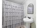 Small bathroom with pedestal sink and ruffled shower curtain at 1420 Old Whitesville Rd, Moncks Corner, SC 29461