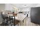 Modern kitchen with white cabinets, granite countertops, and stainless steel appliances at 1420 Old Whitesville Rd, Moncks Corner, SC 29461