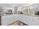 Updated kitchen featuring white cabinets, granite countertops, and a breakfast bar at 1420 Old Whitesville Rd, Moncks Corner, SC 29461