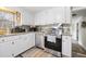 Well-equipped kitchen with white cabinets, granite counters, and stainless steel appliances at 1420 Old Whitesville Rd, Moncks Corner, SC 29461