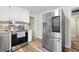 Stainless steel appliances and granite countertops highlight this kitchen at 1420 Old Whitesville Rd, Moncks Corner, SC 29461