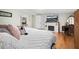 Main bedroom featuring a king-size bed, fireplace, and hardwood floors at 1420 Old Whitesville Rd, Moncks Corner, SC 29461