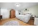 Large main bedroom with hardwood floors, king-size bed, and ample closet space at 1420 Old Whitesville Rd, Moncks Corner, SC 29461