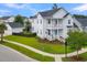 Two-story white house with a detached garage, situated on a corner lot at 1617 Bowsprit Ct, Mount Pleasant, SC 29466