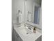 Simple bathroom with white vanity, single sink, and a large mirror at 1617 Bowsprit Ct, Mount Pleasant, SC 29466