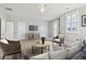 Spacious bonus room with a TV, comfortable seating, and natural light at 1617 Bowsprit Ct, Mount Pleasant, SC 29466